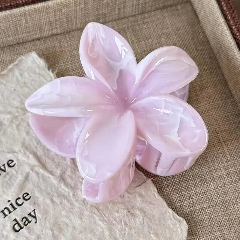 Hawaiian gradient flower hair claw clip with pale pink translucent petals