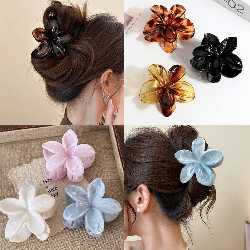 Hawaiian gradient flower hair claw clip set with dark, amber, light blue, and pink flowers