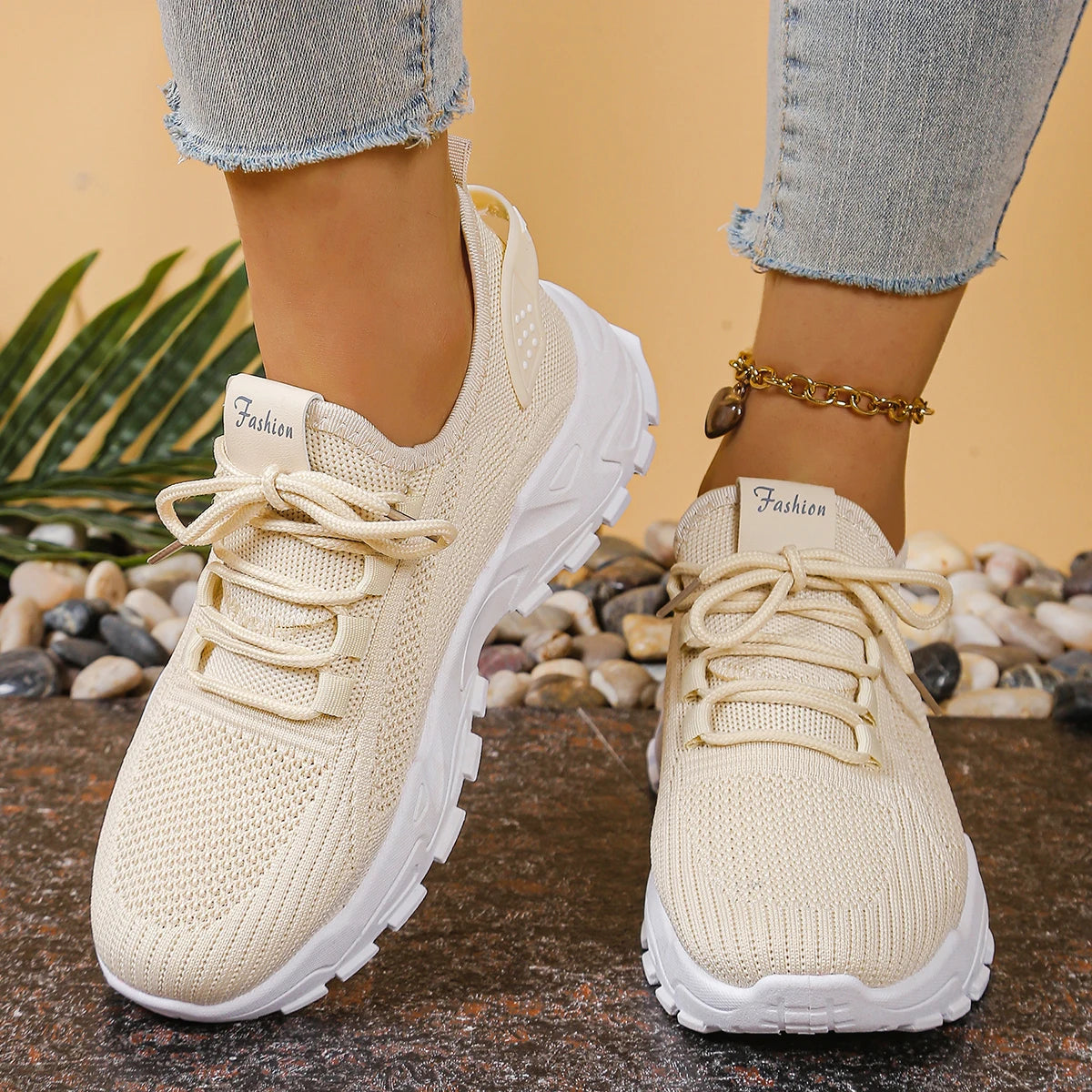 Cedar & Moore women's breathable mesh athletic sneakers with thick white sole and beige knit upper.