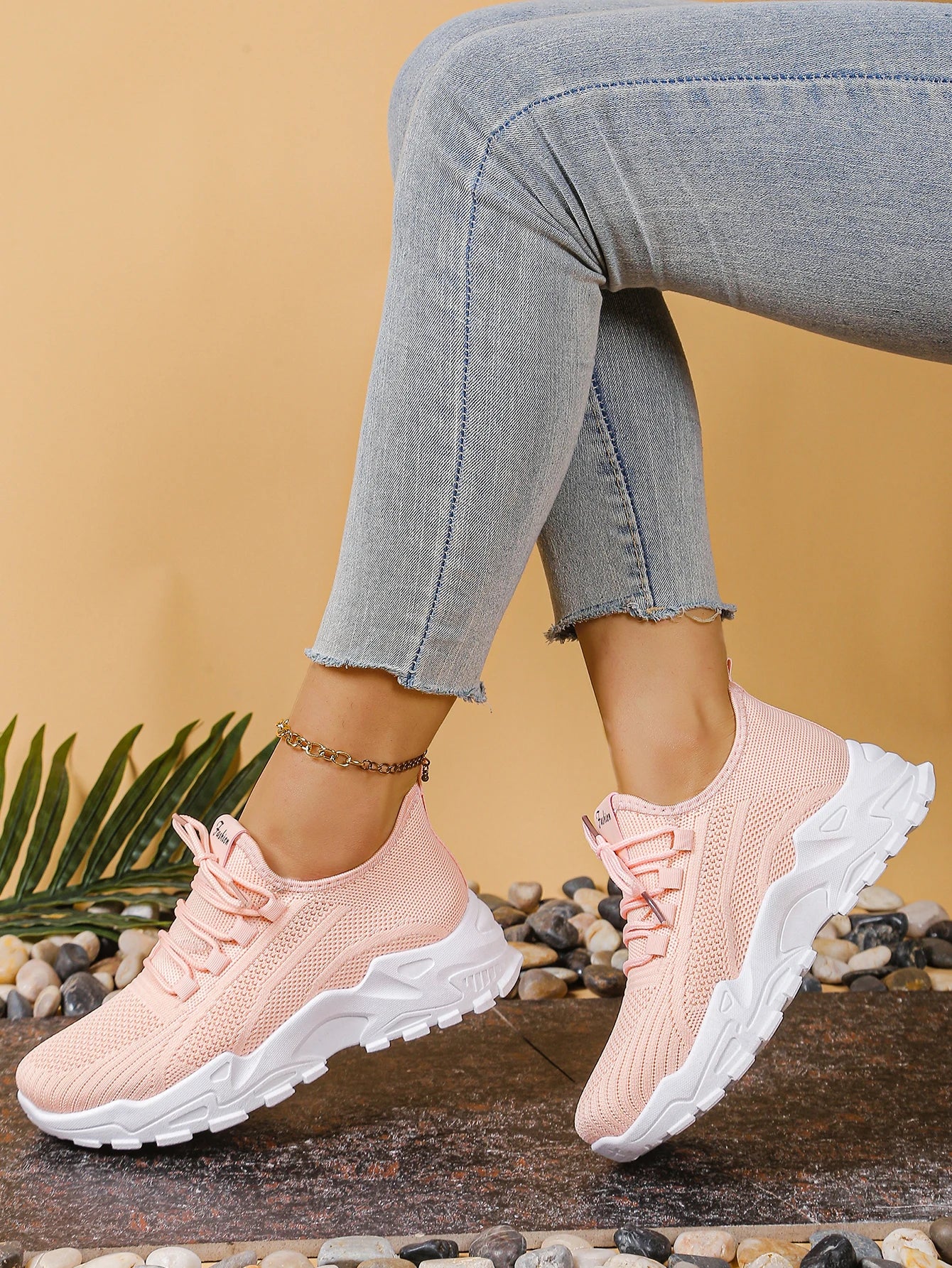 Women's breathable mesh athletic sneakers by Cedar & Moore with thick white sole in blush pink