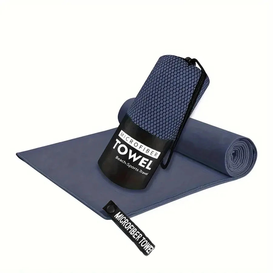 Microfiber yoga gym towel in dark navy, folded with rolled matching towel