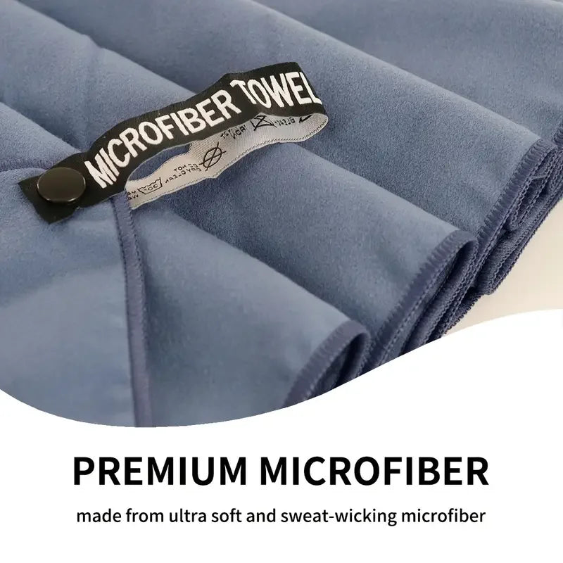 Dark gray microfiber towel with stitched edge and hanging loop label