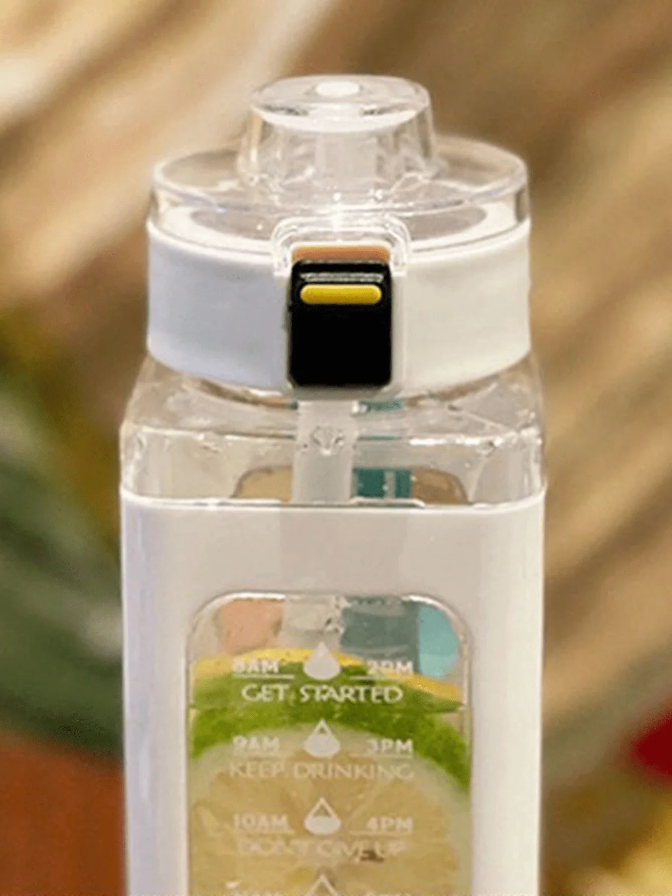White sports water bottle with straw lid and timetable graphic on the front