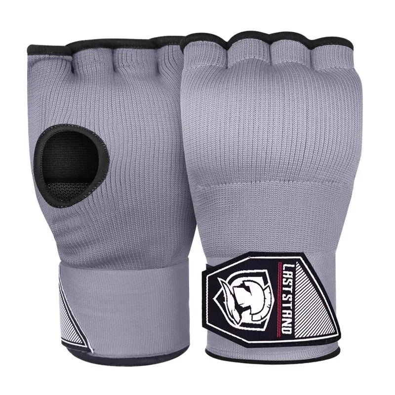 Half finger gel boxing gloves in light gray with open thumb, padded knuckles, and wrist wrap.