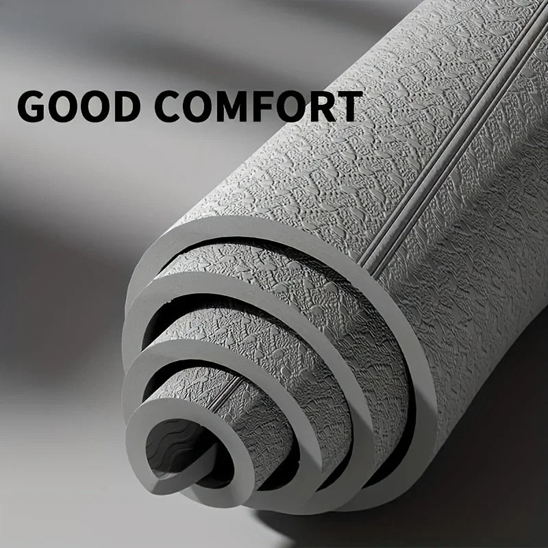 Foldable TPE Gray Yoga Mat, 61x183cm, textured non-slip surface, rolled for travel