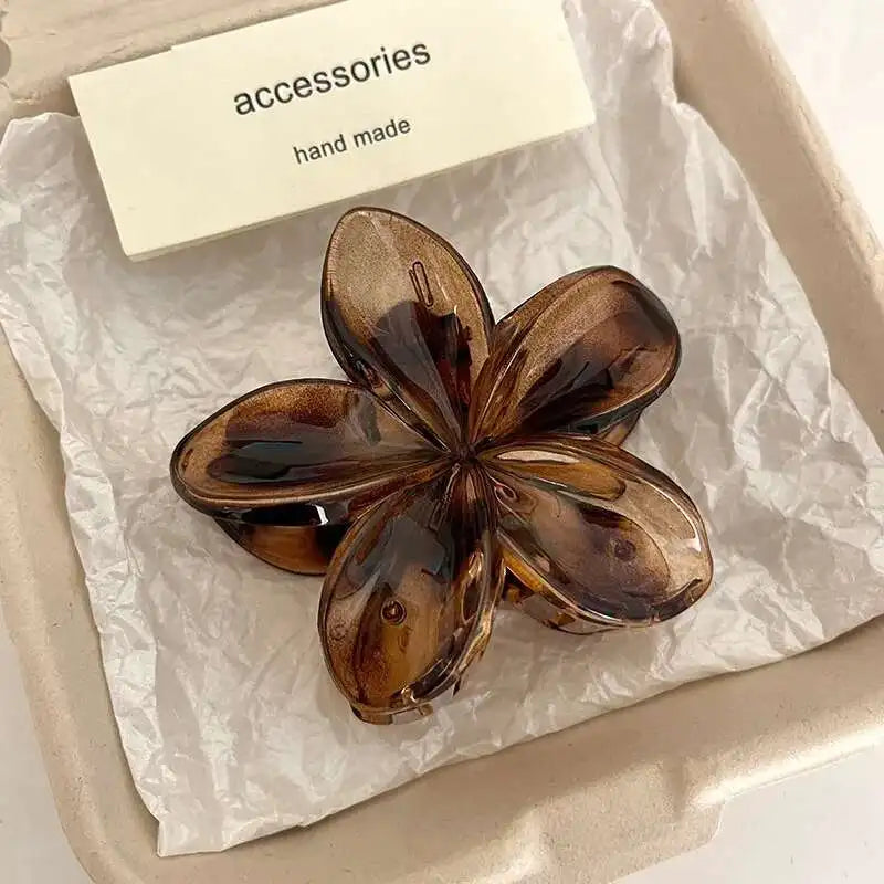 Hawaiian gradient flower hair claw clip in dark brown translucent flower with glossy finish