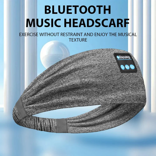 Grey sports headband headphones with side control module and speaker area