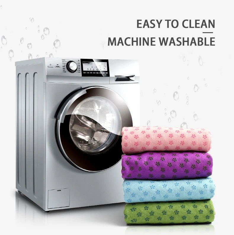 Non-Slip Yoga Towel; set of 4 pastel towels stacked beside a washing machine, machine-washable