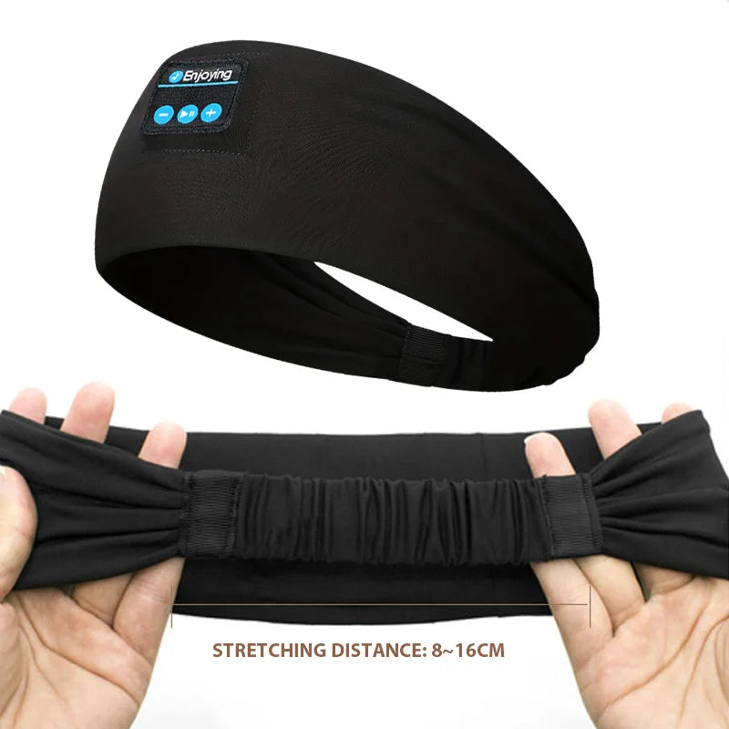 Black wireless sports headband headphones, stretch band with control buttons.