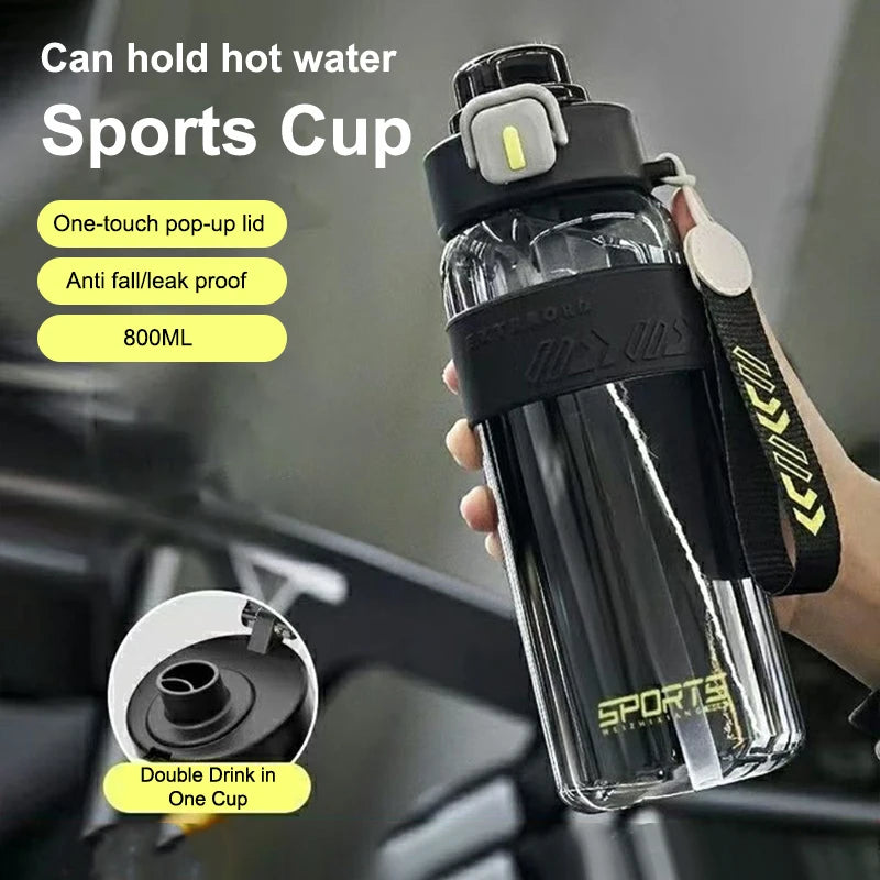 Handheld black sports water bottle with pop-up lid and straw, carry strap attached, 800 ml.