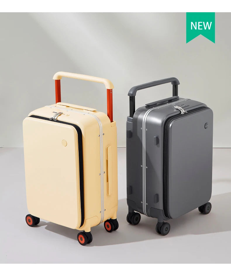 Cream and dark gray carry-on suitcases with contrasting handle colors and spinner wheels