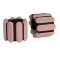Adjustable wrist weight bands in pink with black inserts, two-piece set