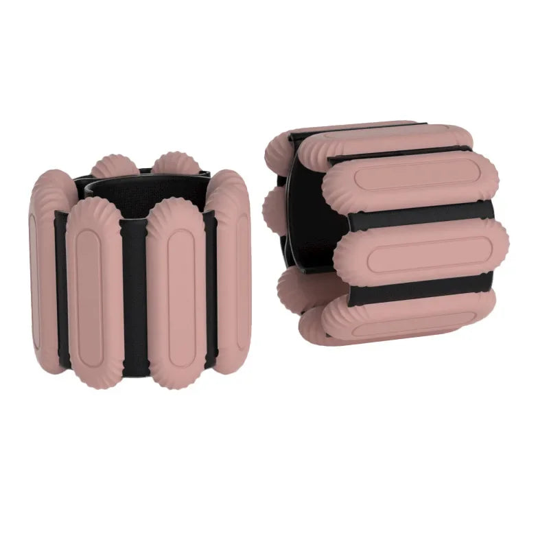 Adjustable wrist weight bands in pink with black inserts, two-piece set