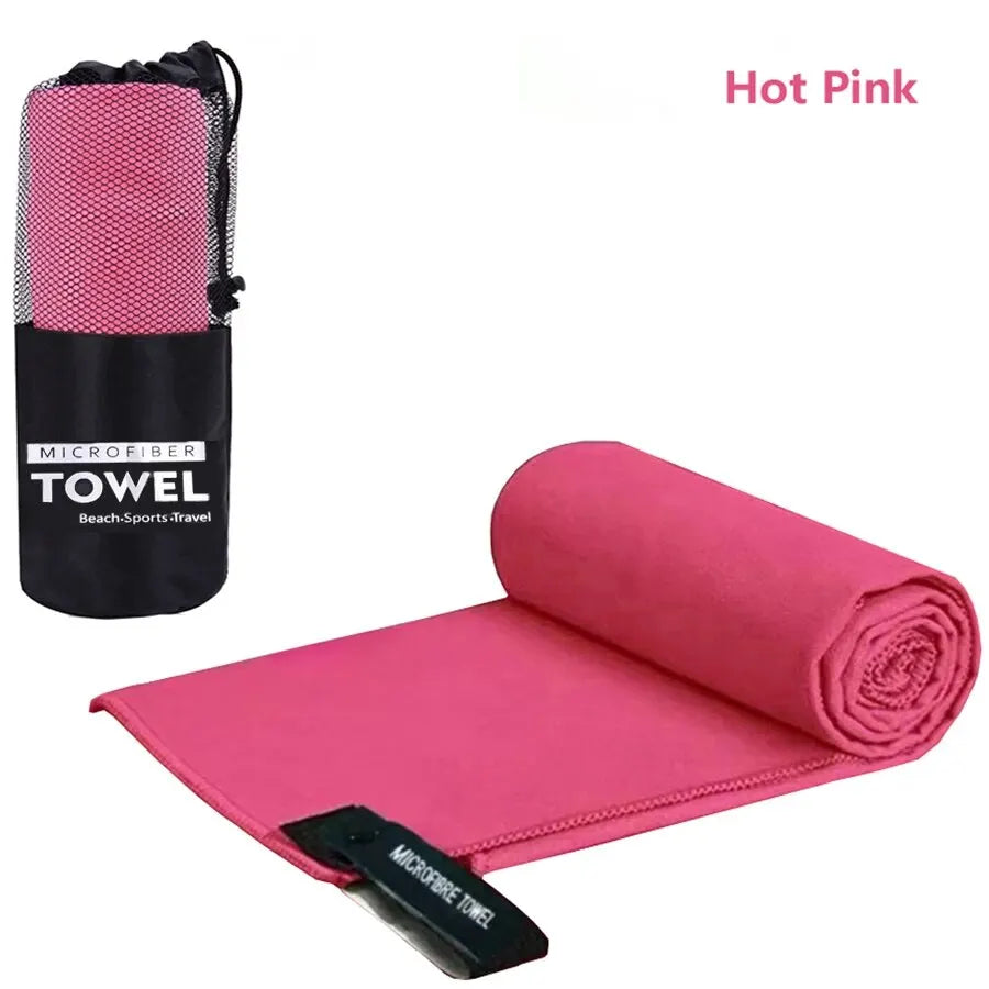Quick-Dry microfiber sports towel in hot pink with mesh storage bag