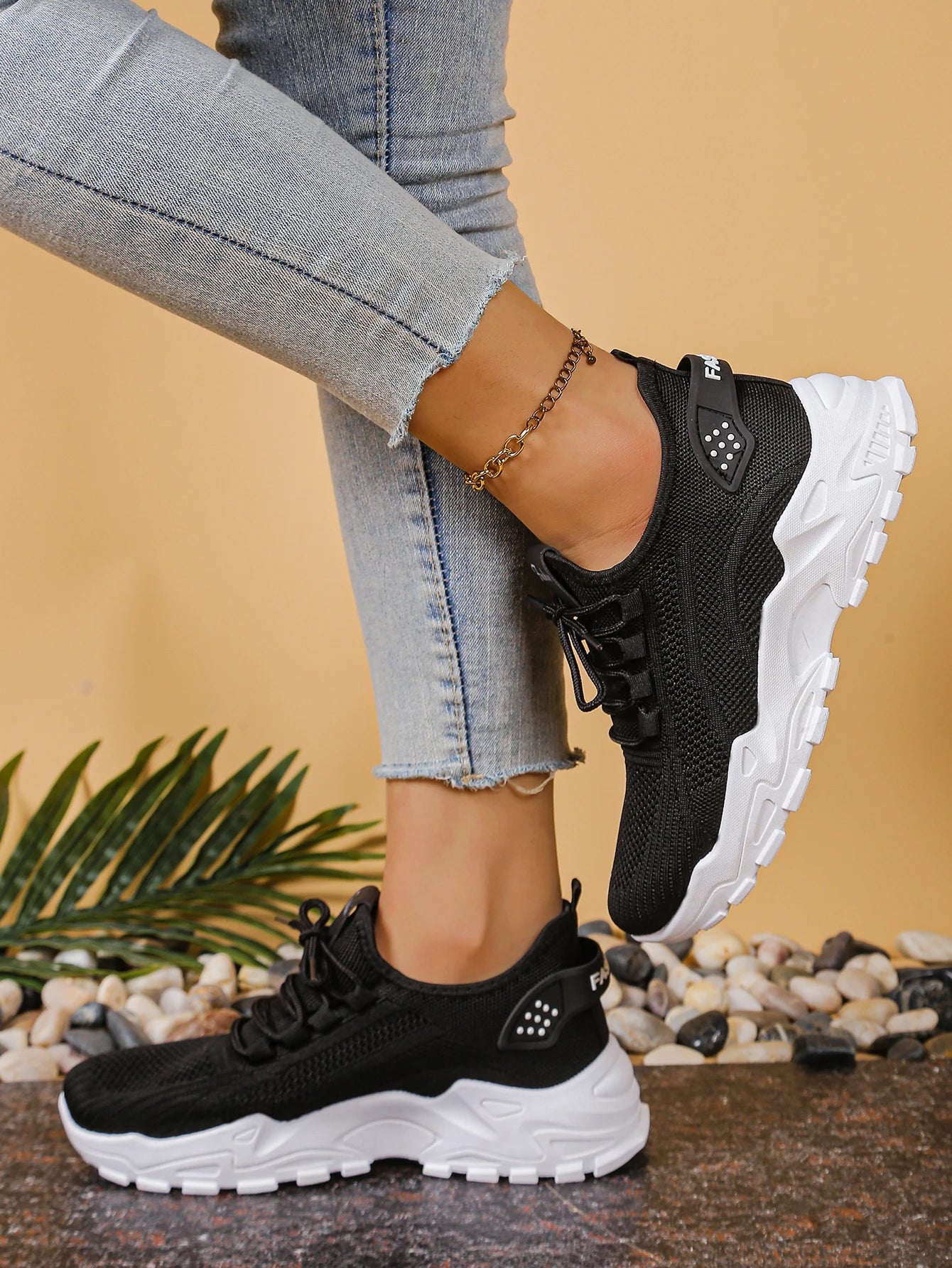 Cedar & Moore women's breathable mesh athletic sneakers with a thick white sole and black upper