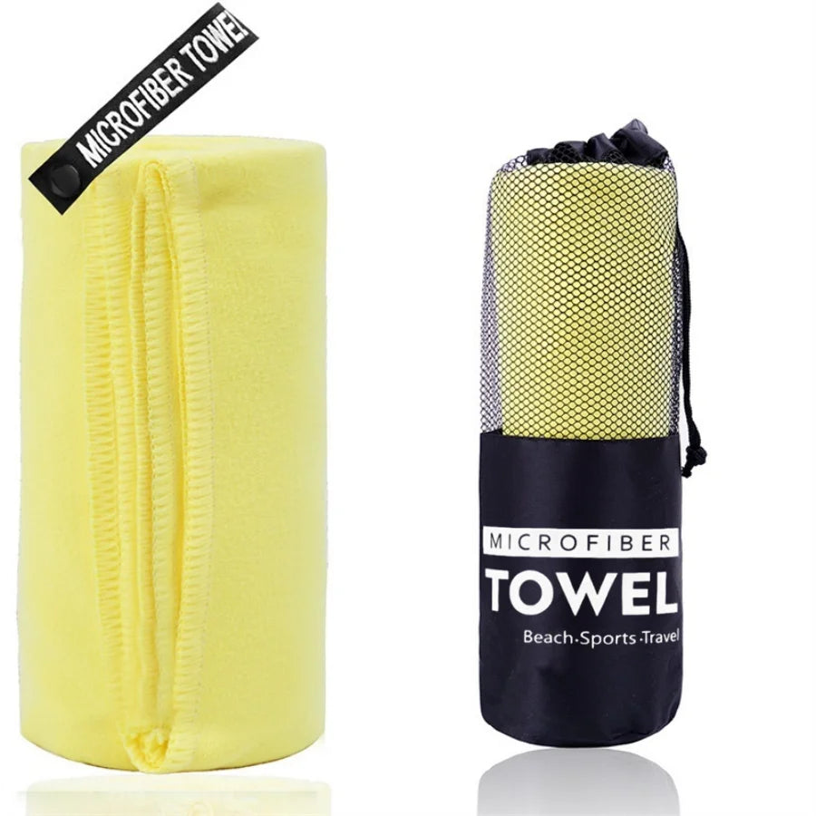 Microfiber beach sports travel towels, bright yellow rolls with mesh texture and black pouch