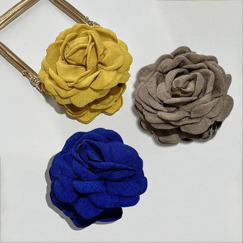 Fabric rose hair claw clips in yellow, gray, and dark blue (3)