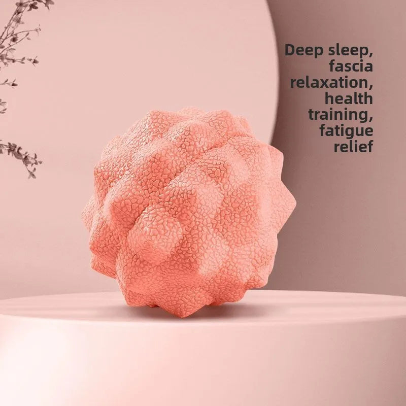 Textured dual-therapy massage ball, coral pink, for muscle relief and myofascial release