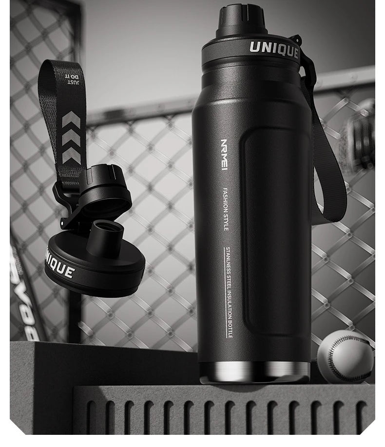 Black insulated stainless steel bottle with carry handle and attached lid