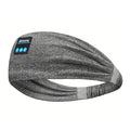 Grey wireless sports headband headphones with built-in control panel.