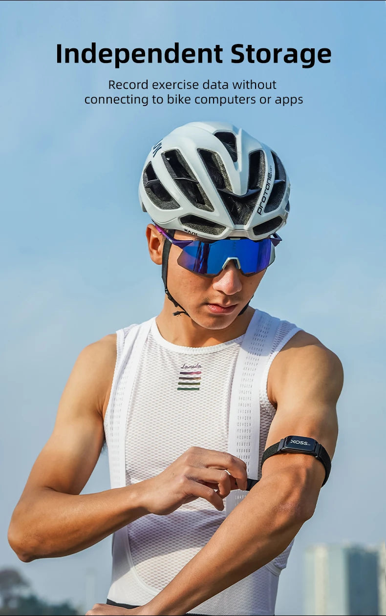 XOSS BBP Bluetooth ANT+ Heart Rate Monitor Armband on forearm, black strap with XOSS logo and blue display.