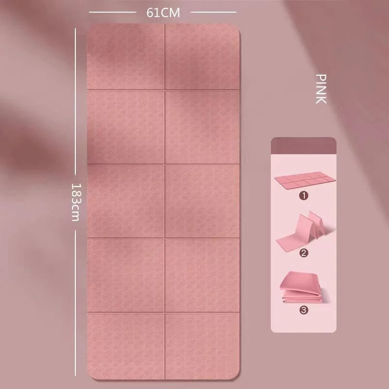 Foldable yoga mat in pink, folded with panel seams and textured non-slip surface