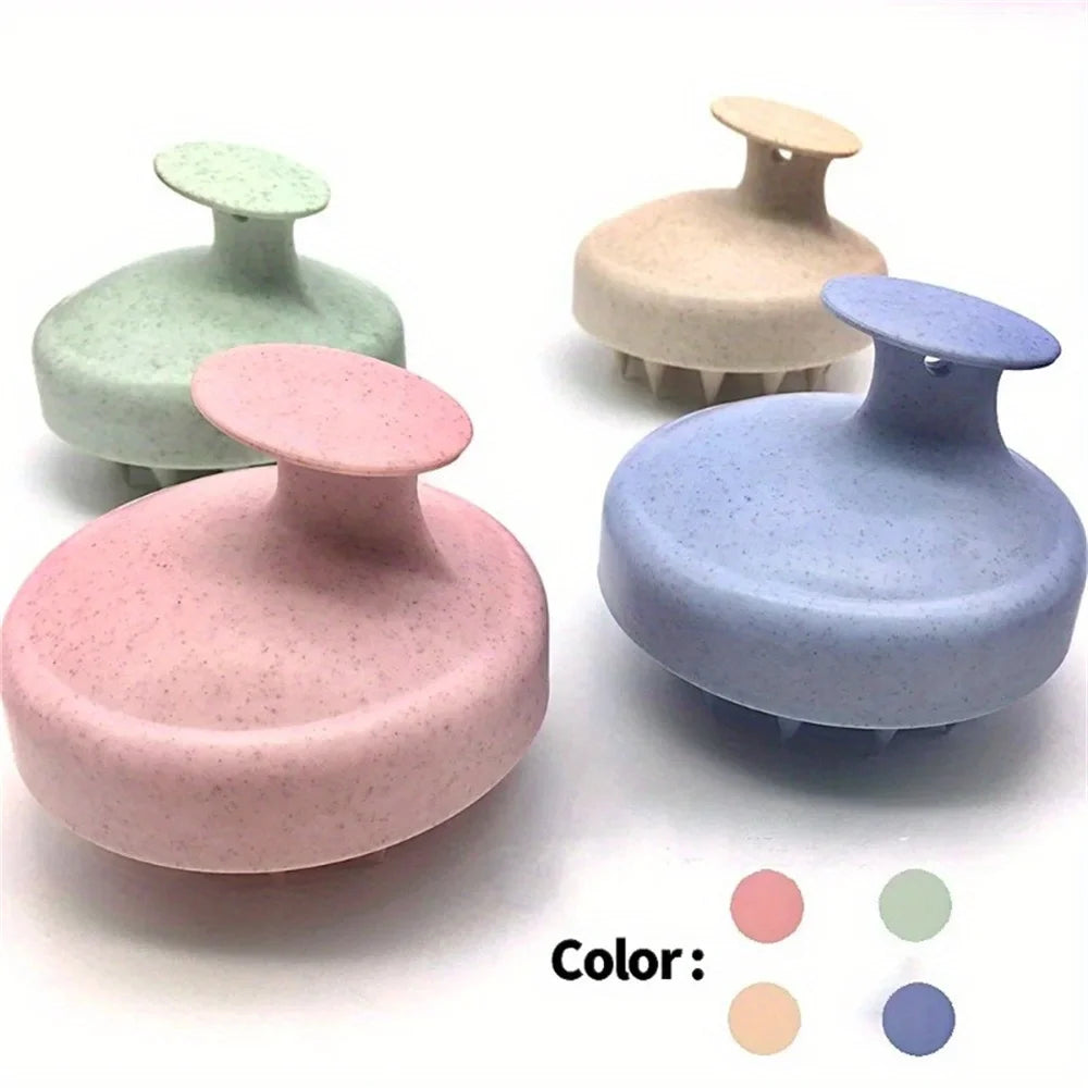 Silicone scalp massage brush in pastel colors, rounded base with prong tips