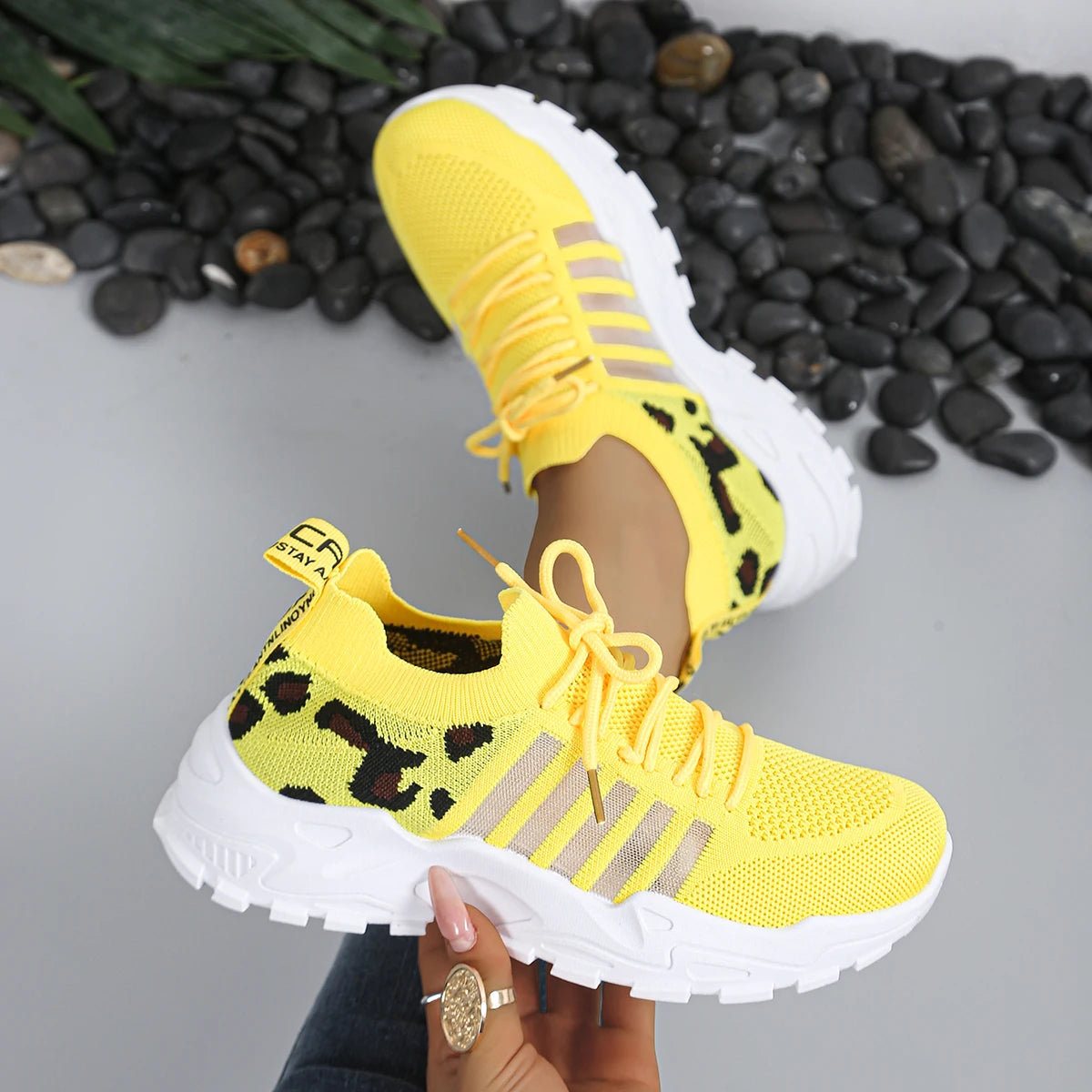 Pair of Women's Leopard Print Athletic Sneakers - Cedar & Moore, breathable knit upper, thick white sole