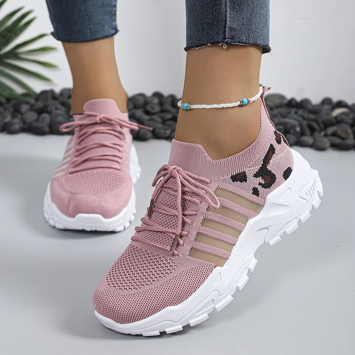 Pair of Women's Cedar & Moore pink leopard-print breathable-knit athletic sneakers with thick white sole