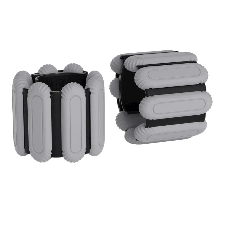 Adjustable wrist weight bands in light gray with black inserts, two-piece set