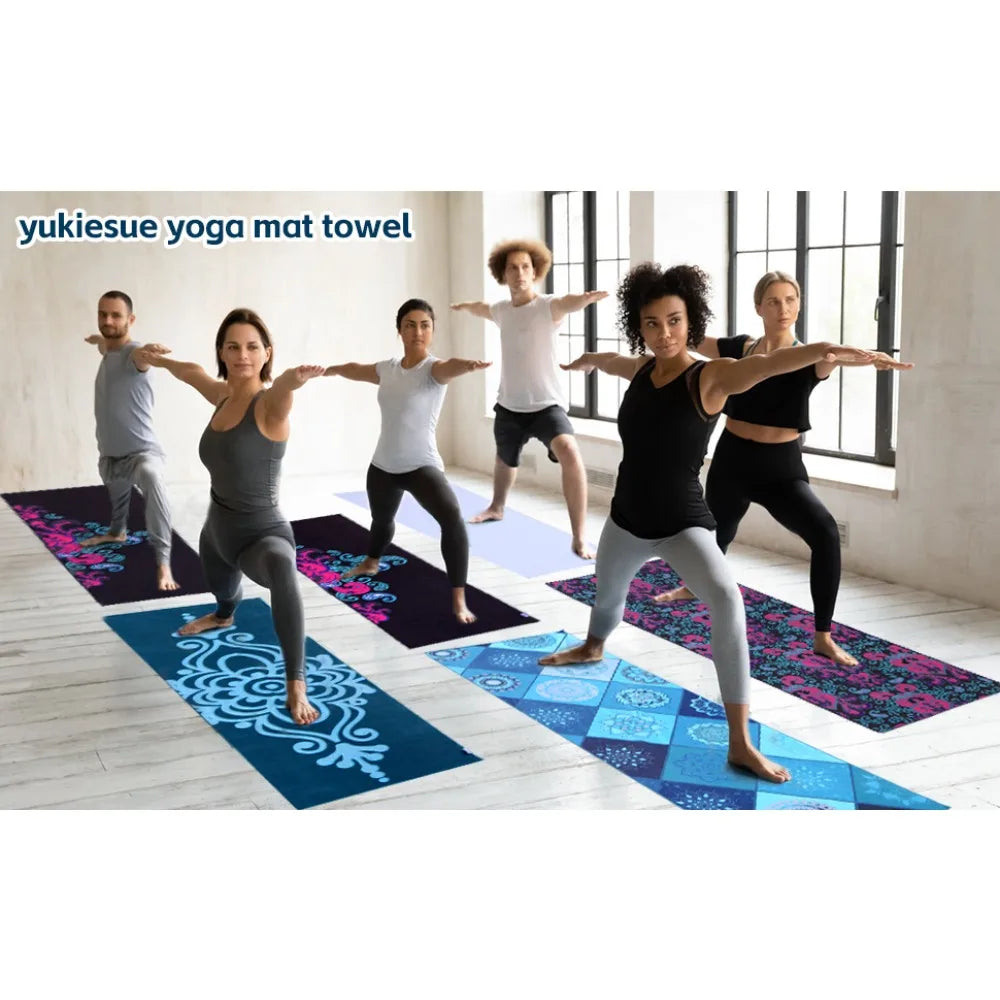 Blue patterned yoga mat towels laid out for yoga class