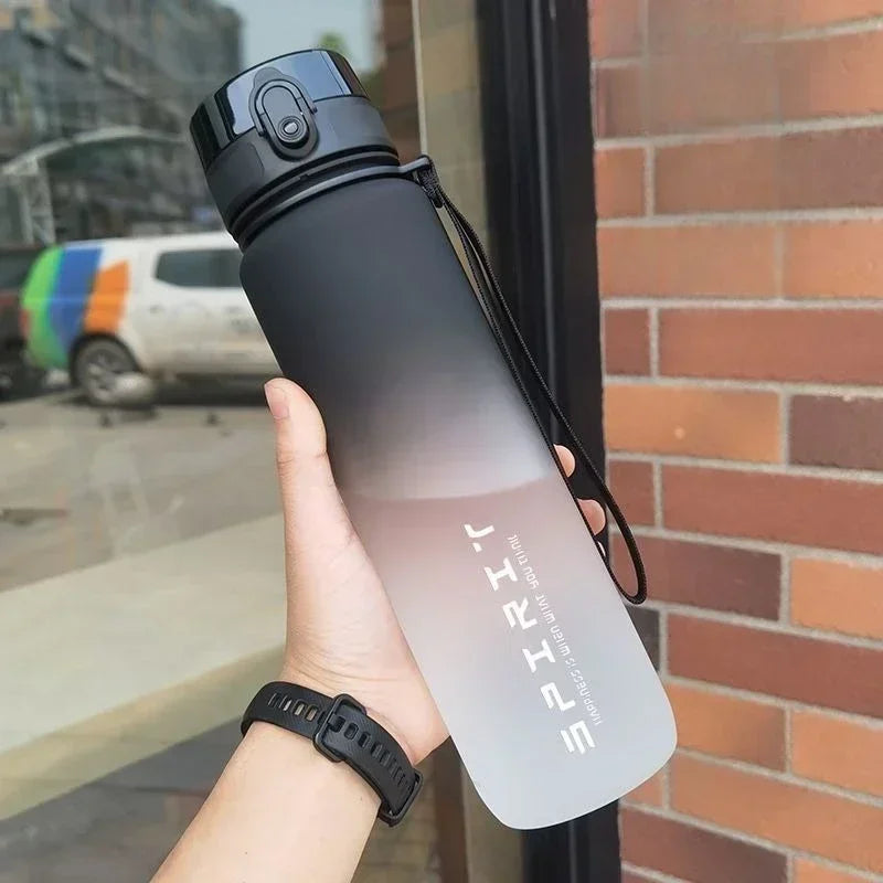 Sports water bottle with straw, matte black and white gradient, flip-top lid and wrist loop