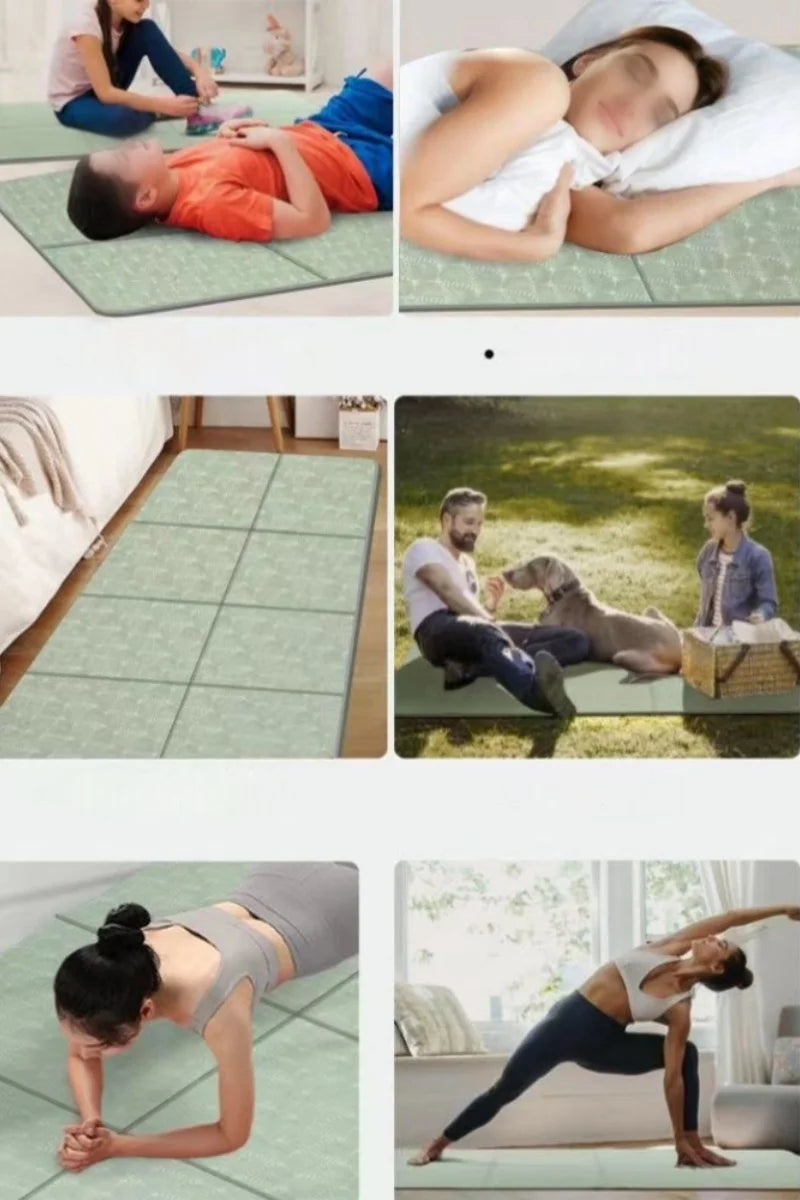Foldable yoga mat in light green shown in use for floor stretching and poses