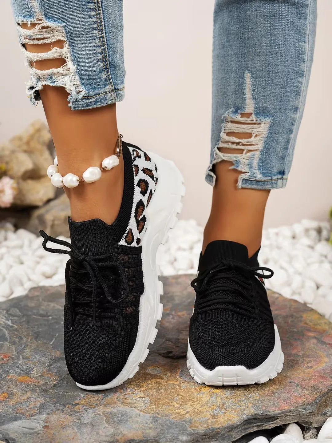 Women's Cedar & Moore leopard-print athletic sneakers, black knit upper with leopard side panel, white chunky sole, pair