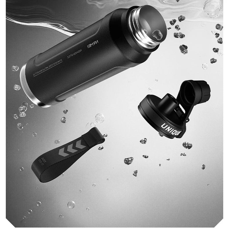 Insulated stainless steel sports bottle with drinking spout and lid components, dark finish