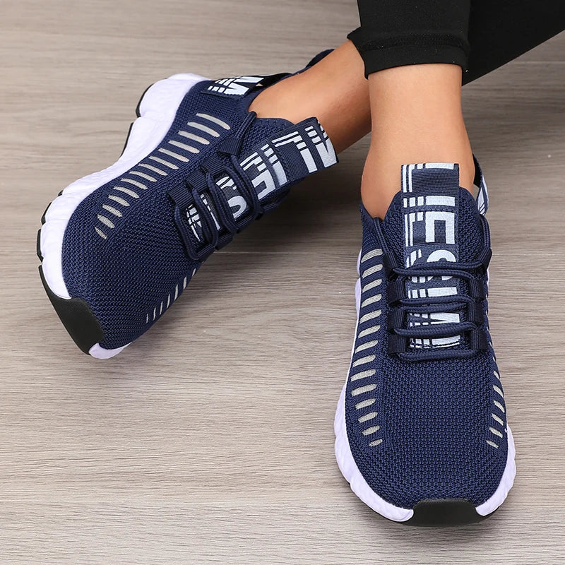 Women’s lightweight running shoes, navy knit upper with strap closure and white sole