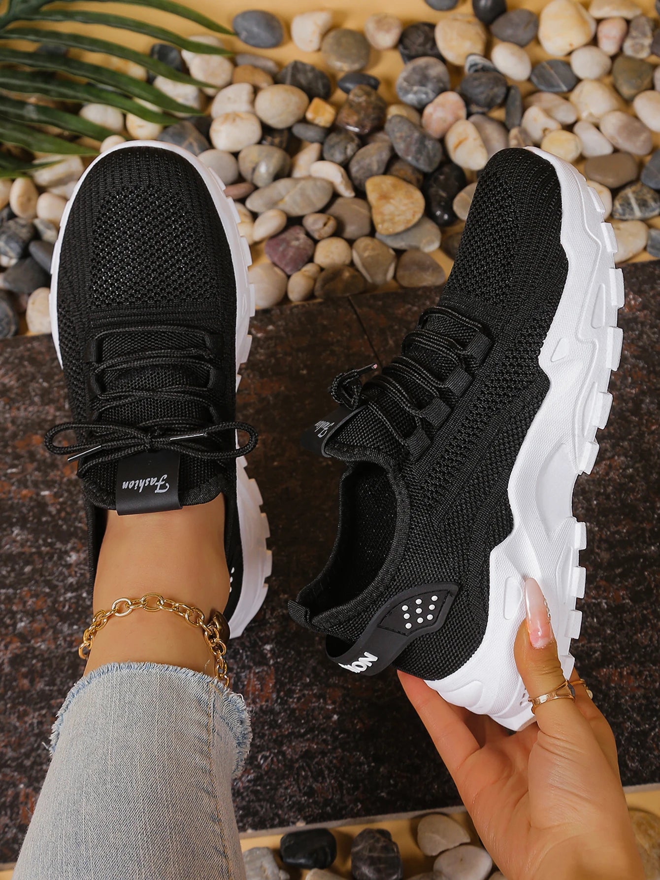Women's breathable mesh athletic sneakers by Cedar & Moore, black uppers with thick white sole, pair