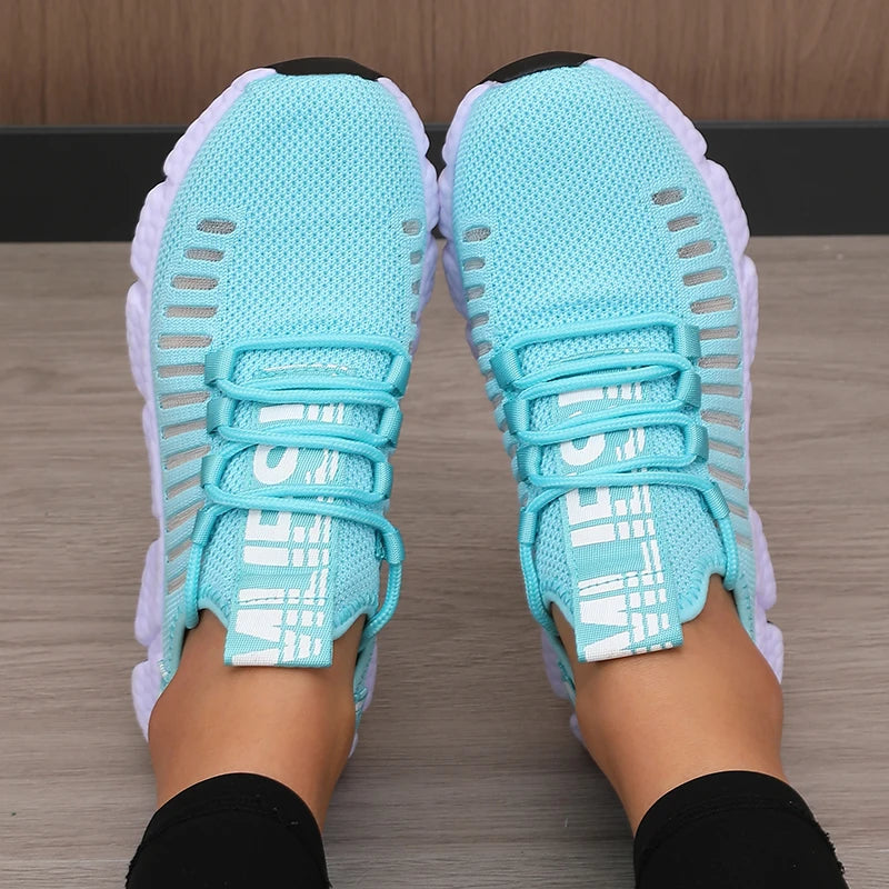 Lightweight running shoes in light blue with white soles and lace-up straps