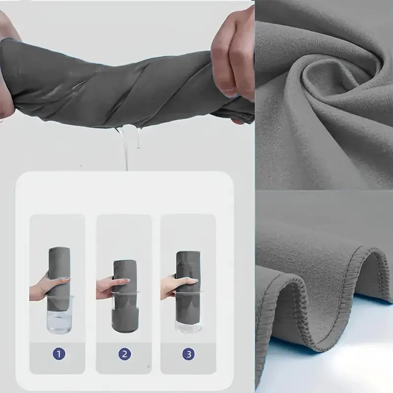 Dark gray microfiber towel folded and rolled fabric close-up