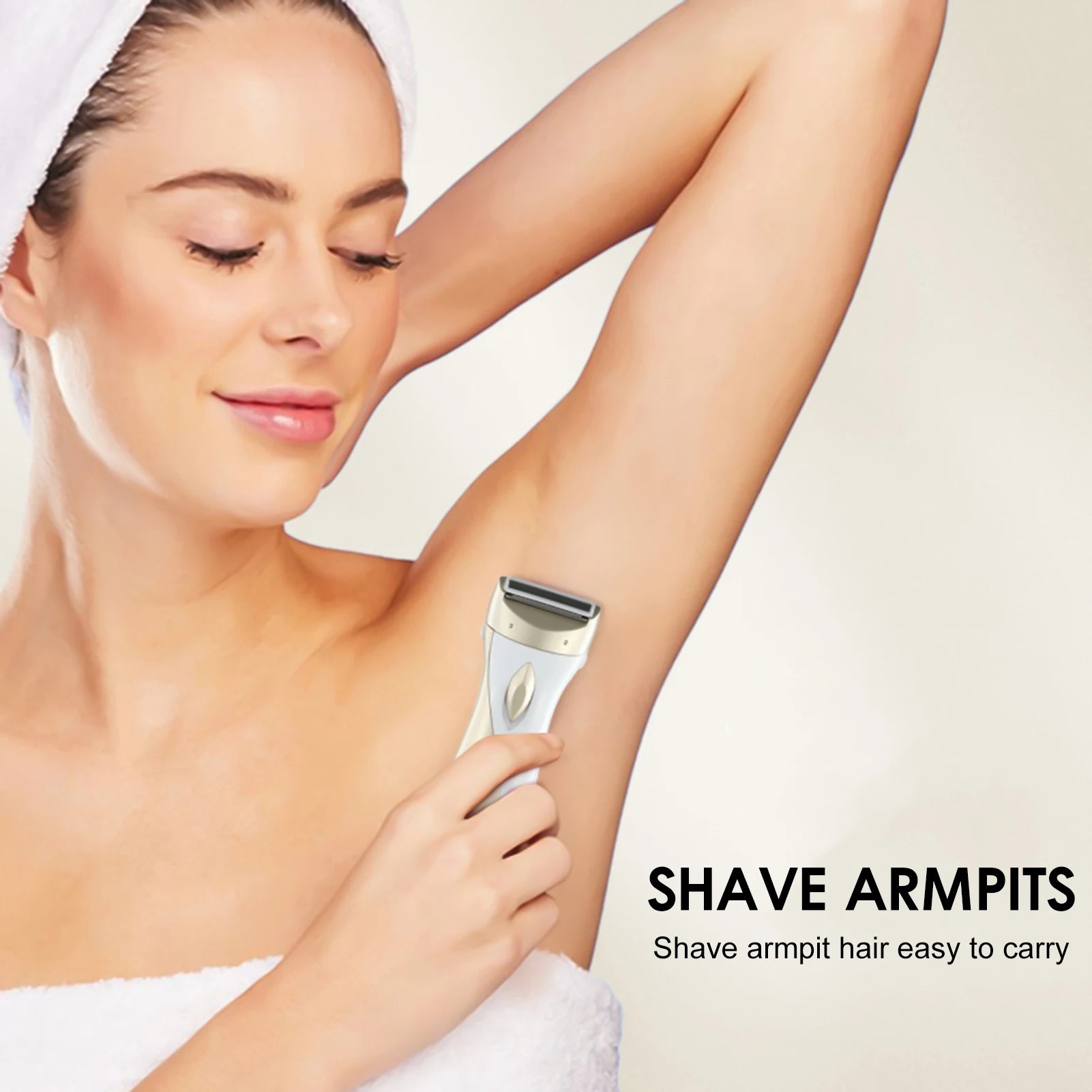 Woman using a rechargeable epilator on her underarm with shaving head