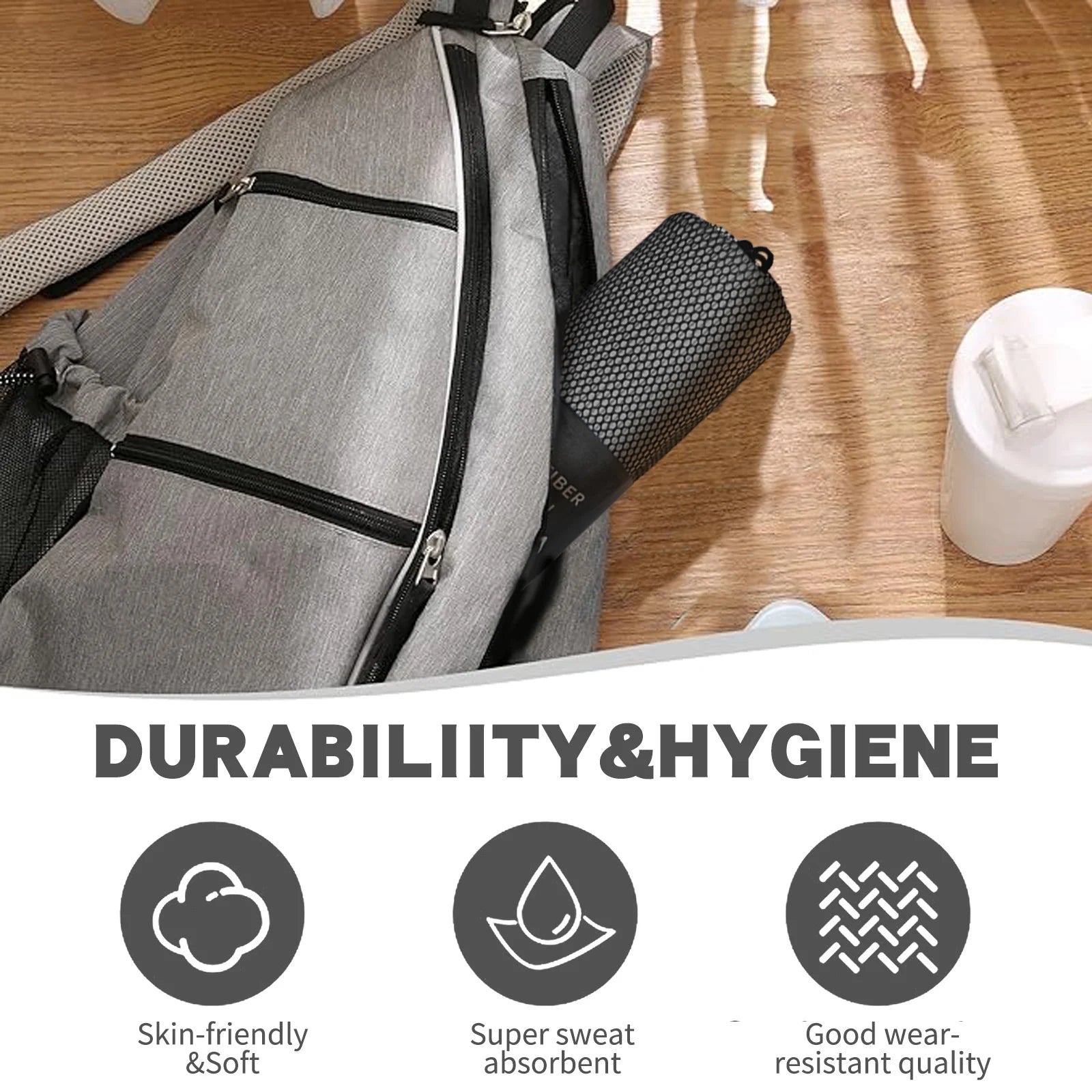 Premium Non-Slip Yoga Towel by Cedar & Moore with silicone grip and carry bag beside a gray backpack