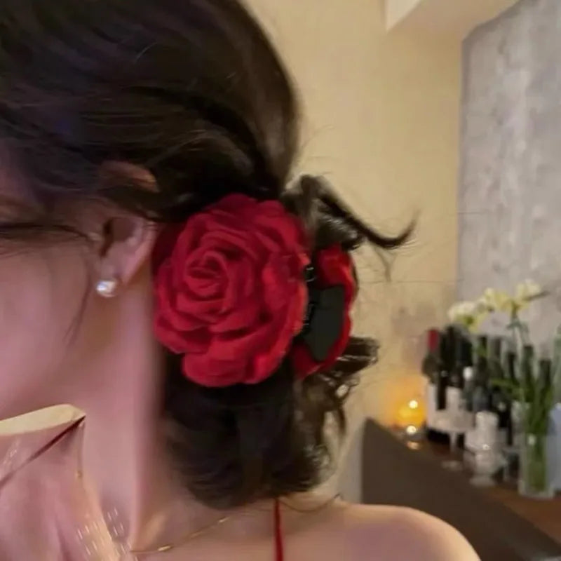 Red fabric rose hair claw clip with black base