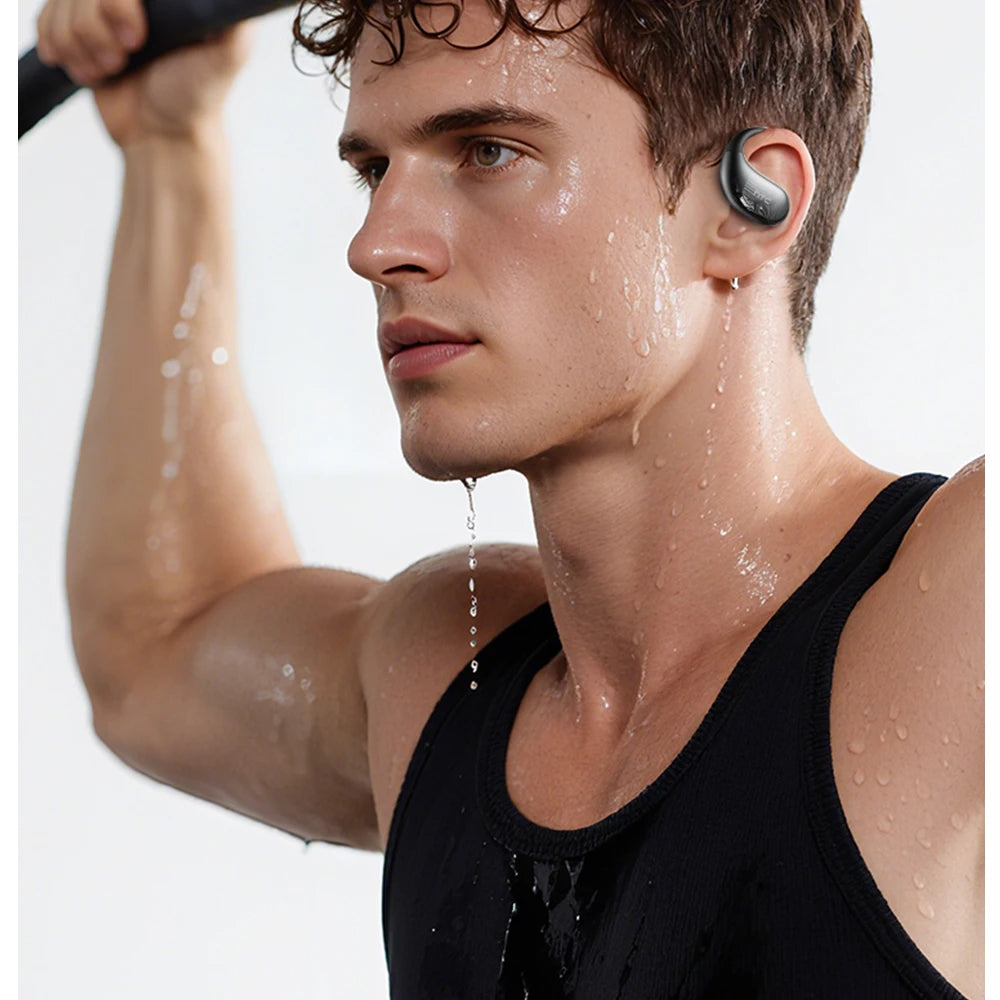 Black sports wireless earbuds in-ear on a sweaty man, workout pose