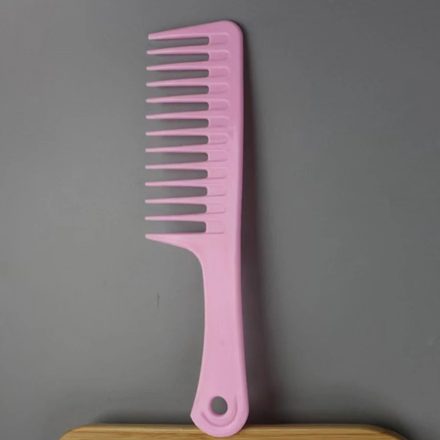 Pink wide-tooth hair comb with curved handle and evenly spaced tines
