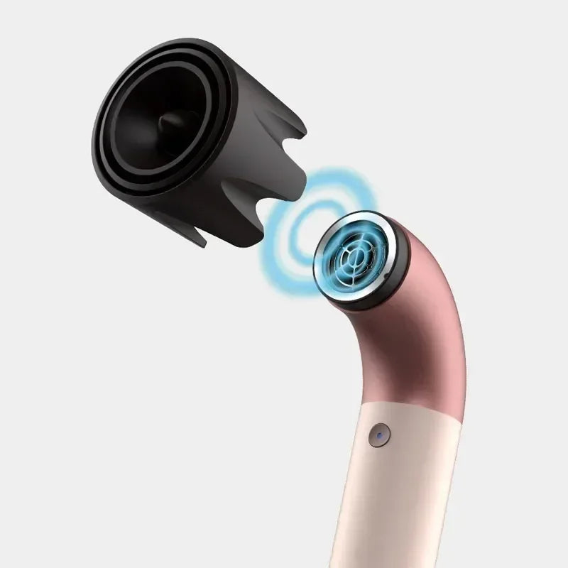 Pink and cream hair dryer with concentrator nozzle, showing cool airflow ring detail