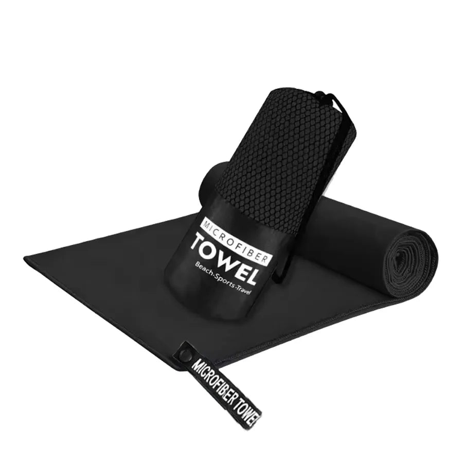 Microfiber yoga gym towel in black, folded with rolled matching towel