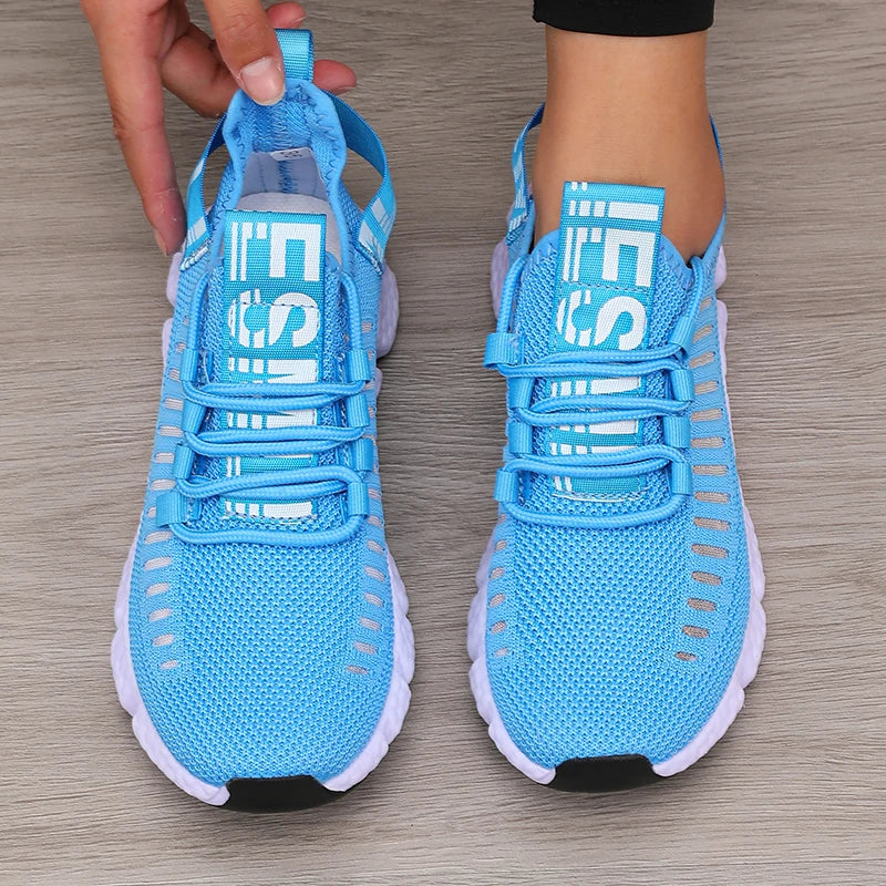 Lightweight running shoes in sky blue with white soles and lace-up straps