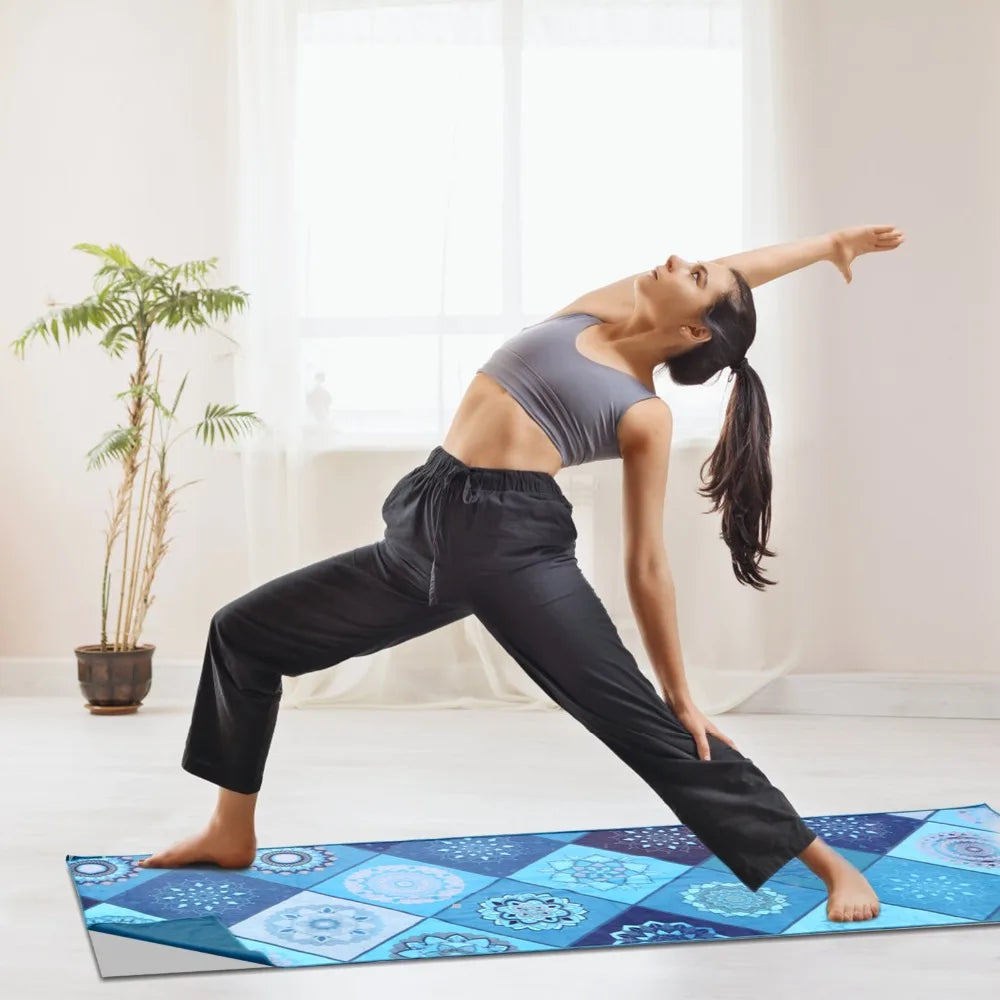 Blue patterned yoga mat towel on floor for hot yoga poses