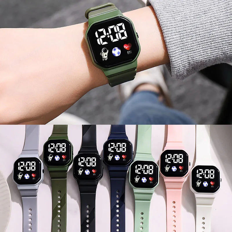 Kids LED digital watch with green silicone strap and black square digital display