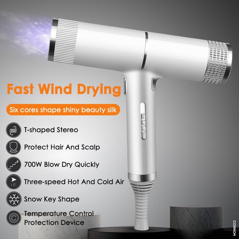 Professional hair dryer with silver barrel and side control buttons